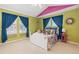 Colorful bedroom with a hanging swing chair, whimsical decor, and lots of natural light at 2488 Lake Vista Dr, Broomfield, CO 80023