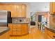Well-lit kitchen features stainless steel appliances, granite countertops, and wooden cabinets at 2488 Lake Vista Dr, Broomfield, CO 80023