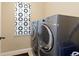 Modern laundry room with new front-load washer and dryer at 2488 Lake Vista Dr, Broomfield, CO 80023
