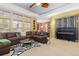 Open concept living room features a piano, lots of natural light, and neutral walls and carpets at 2488 Lake Vista Dr, Broomfield, CO 80023