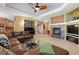 The open-concept living room offers a piano, fireplace, and seamless flow to the kitchen, great for entertaining at 2488 Lake Vista Dr, Broomfield, CO 80023