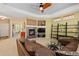 This large living room offers a fireplace, plenty of natural light, and seamless flow to the office space at 2488 Lake Vista Dr, Broomfield, CO 80023