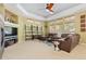 Spacious living room with modern furniture, fireplace, and large windows that provide ample natural light at 2488 Lake Vista Dr, Broomfield, CO 80023
