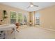 Bright office featuring three windows, neutral walls, and carpet flooring, ideal for a work-from-home space at 2488 Lake Vista Dr, Broomfield, CO 80023