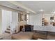Comfortable finished basement with neutral carpet, closet, and cozy seating area at 5342 S Halifax Cir, Centennial, CO 80015