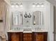 Elegant bathroom featuring double vanities, modern fixtures, and plenty of counter space at 5342 S Halifax Cir, Centennial, CO 80015