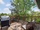 Relaxing deck features wood flooring, metal railings, comfortable seating, and a grill at 5342 S Halifax Cir, Centennial, CO 80015
