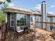 Outdoor deck with seating area, wood railings, and a view of the backyard at 5342 S Halifax Cir, Centennial, CO 80015