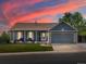 Charming single-Gathering home featuring a well-maintained lawn, covered porch, and two-car garage at 5342 S Halifax Cir, Centennial, CO 80015