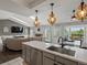 Spacious open-concept kitchen with view of living room, dining area and fireplace at 5342 S Halifax Cir, Centennial, CO 80015