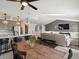 Open-concept living area flowing into dining and kitchen with ample natural light at 5342 S Halifax Cir, Centennial, CO 80015