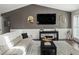 Cozy living room showcasing dark accent wall, modern console table, and stylish decor at 5342 S Halifax Cir, Centennial, CO 80015