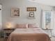 Bright main bedroom featuring a comfortable bed and tasteful decorations for a relaxing retreat at 5342 S Halifax Cir, Centennial, CO 80015