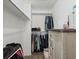 Walk-in closet with ample clothing racks, shelving and a built-in storage cabinet at 5342 S Halifax Cir, Centennial, CO 80015