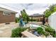 Charming backyard featuring a cozy patio with a gazebo, water feature, and a play area for  at 10478 Ogden St, Northglenn, CO 80233