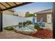 Outdoor living with a quaint brick-lined pond, water feature, and pergola-covered patio perfect for relaxing at 10478 Ogden St, Northglenn, CO 80233