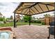 Inviting backyard with a gazebo, patio, play set, and lush lawn, perfect for outdoor enjoyment at 10478 Ogden St, Northglenn, CO 80233