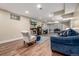 Basement with living room area, fireplace, piano and recessed lighting at 10478 Ogden St, Northglenn, CO 80233