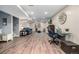 Finished basement features a spacious sitting area, desk area, and wood-look flooring at 10478 Ogden St, Northglenn, CO 80233