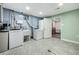 Basement with washer and dryer hookups, utility sink, and open space for various needs at 10478 Ogden St, Northglenn, CO 80233