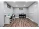 Basement study area features two desks, two chairs, and a piano at 10478 Ogden St, Northglenn, CO 80233