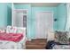 Shared bedroom with two beds, hardwood floors, soft colors, and ample closet space at 10478 Ogden St, Northglenn, CO 80233