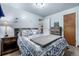 Charming bedroom offering carpeted floors, a decorative headboard and modern furniture at 10478 Ogden St, Northglenn, CO 80233