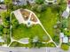 Aerial view of a community park with playground, basketball court, and walking paths at 10478 Ogden St, Northglenn, CO 80233