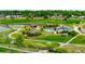 Scenic community park with a pond, trails, picnic areas, and playground equipment at 10478 Ogden St, Northglenn, CO 80233