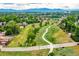 Scenic community view featuring green spaces, walking paths, and distant mountains at 10478 Ogden St, Northglenn, CO 80233