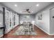 Stylishly decorated dining room showcases hardwood floors, soft gray walls, and ample natural light at 10478 Ogden St, Northglenn, CO 80233