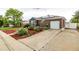 Classic brick home with solar panels, a long driveway, and meticulously maintained landscaping at 10478 Ogden St, Northglenn, CO 80233