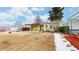 View of house and backyard with garden beds at 1935 Nome St, Aurora, CO 80010