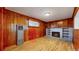 Cozy basement recreation room with wood paneling and fireplace at 1935 Nome St, Aurora, CO 80010