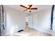 Well-lit bedroom with hardwood floors and ceiling fan at 1935 Nome St, Aurora, CO 80010