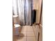 Bathroom featuring a toilet and shower curtain at 1242 S Seneca Way, Denver, CO 80223