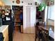 Kitchen with abundant pantry space, a refrigerator, dining table, and chairs at 1242 S Seneca Way, Denver, CO 80223
