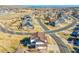 Aerial view of the property showcasing its location within a well-planned community with mature landscaping and nearby lake at 8726 Gardenia Cir, Arvada, CO 80005