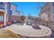 Well-designed patio area with ample seating, an outdoor grill, and a cozy fire pit perfect for entertaining at 8726 Gardenia Cir, Arvada, CO 80005
