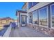 Inviting deck with seating area and views of the yard and neighborhood at 8726 Gardenia Cir, Arvada, CO 80005