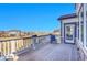 Relaxing deck space with a chair and views of the neighborhood at 8726 Gardenia Cir, Arvada, CO 80005
