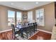 Cozy dining room with a large window and hardwood floors, perfect for Gathering dinners at 8726 Gardenia Cir, Arvada, CO 80005