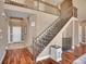 Entryway with hardwood floors, stairs to the upper level, and neutral color scheme at 8726 Gardenia Cir, Arvada, CO 80005
