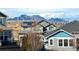 View of residential neighborhood showcasing mountain views in the background on a sunny day at 8726 Gardenia Cir, Arvada, CO 80005