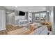 Relaxing living room featuring a sectional sofa and large window at 8726 Gardenia Cir, Arvada, CO 80005