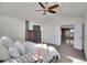 Bright main bedroom with vaulted ceilings, ceiling fan, and an adjacent loft-style sitting area at 8726 Gardenia Cir, Arvada, CO 80005