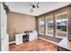 Lovely home office with bright windows, hardwood floors, and a built-in bookshelf at 8726 Gardenia Cir, Arvada, CO 80005