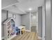 Cozy playroom with a bookshelf, small table and chairs, and a view into the bathroom at 8726 Gardenia Cir, Arvada, CO 80005