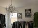 Charming bedroom featuring a decorative chandelier, closet, and decor at 2617 Channel Dr, Highlands Ranch, CO 80129