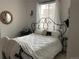 Comfortable bedroom with a wrought iron bed frame, soft bedding, and natural light at 2617 Channel Dr, Highlands Ranch, CO 80129
